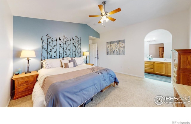 bedroom with ceiling fan, light colored carpet, and vaulted ceiling