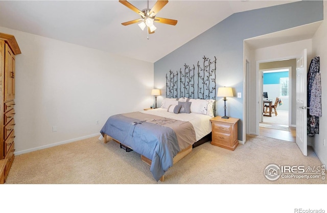 bedroom featuring ceiling fan, vaulted ceiling, and light carpet