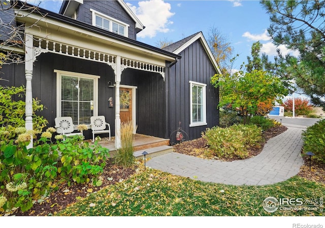 view of front facade featuring board and batten siding and covered porch