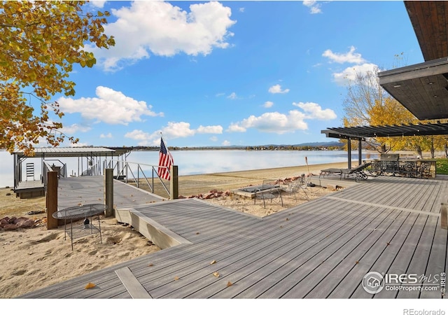 dock area featuring a pergola and a water view