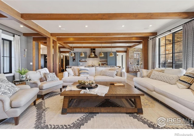 living room featuring beam ceiling and recessed lighting