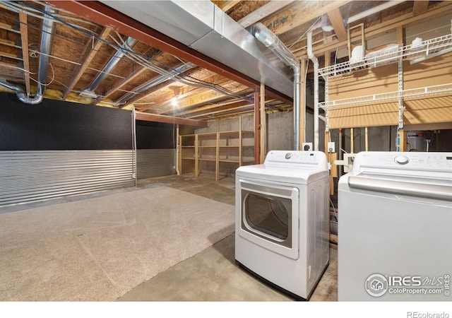 clothes washing area with washer and dryer