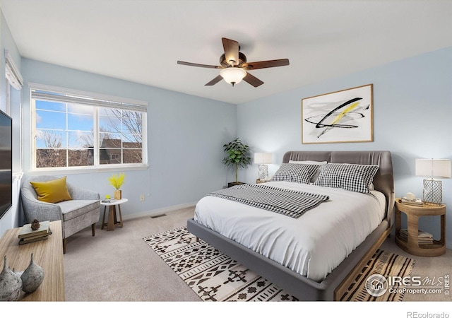 carpeted bedroom featuring ceiling fan