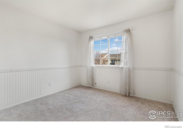 unfurnished room featuring carpet
