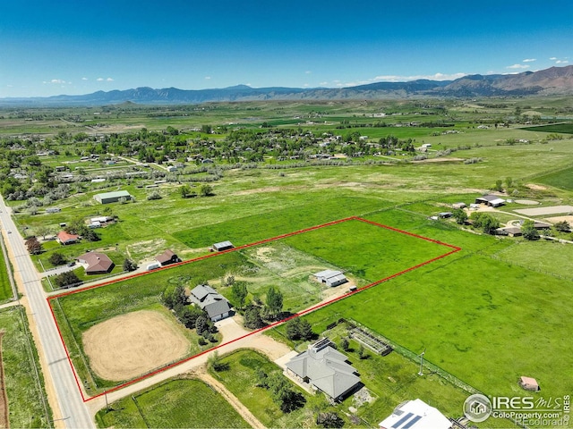 bird's eye view featuring a mountain view and a rural view