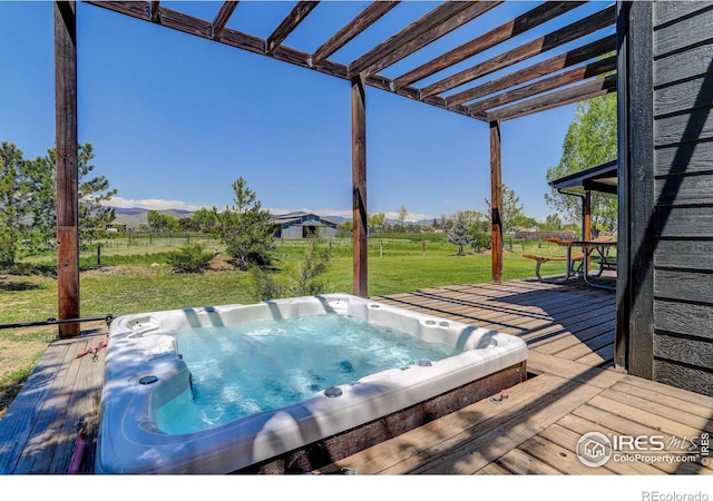 view of swimming pool featuring a deck, a pergola, and a yard