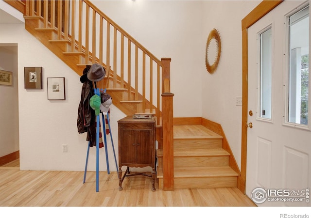 staircase with wood-type flooring