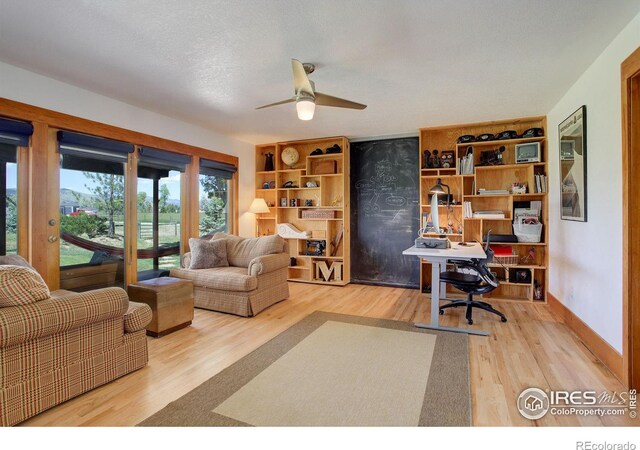 office featuring ceiling fan, a textured ceiling, and hardwood / wood-style flooring