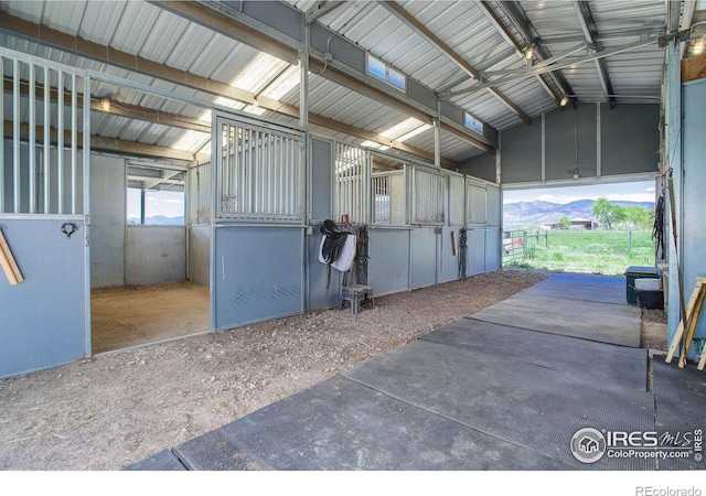 view of horse barn with a mountain view