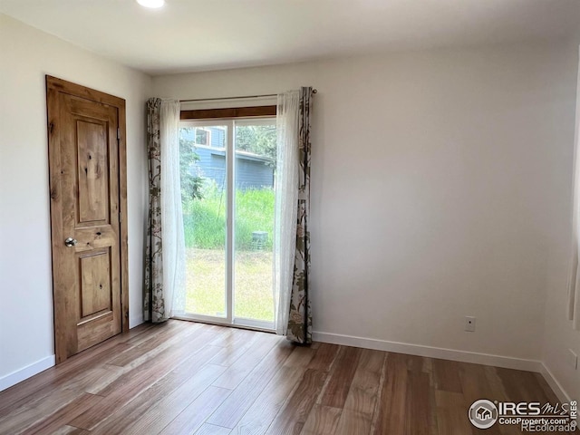 spare room featuring light wood-type flooring