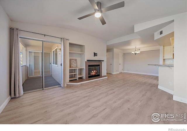 770 Copper Ln Unit 206, Louisville, CO 80027 - unfurnished living room with light hardwood / wood-style floors, built in features, and ceiling fan with notable chandelier