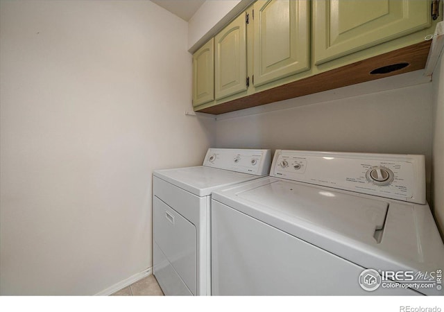 770 Copper Ln Unit 206, Louisville, CO 80027 - washroom with cabinets, separate washer and dryer, and light tile patterned flooring