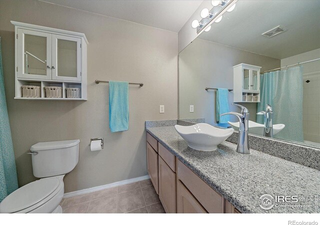 770 Copper Ln Unit 206, Louisville, CO 80027 - bathroom with toilet, vanity, a shower with curtain, and tile patterned floors