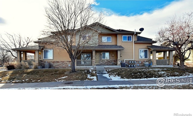 view of front of house featuring central AC unit and a porch