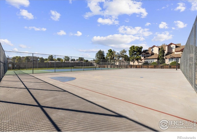 surrounding community with tennis court