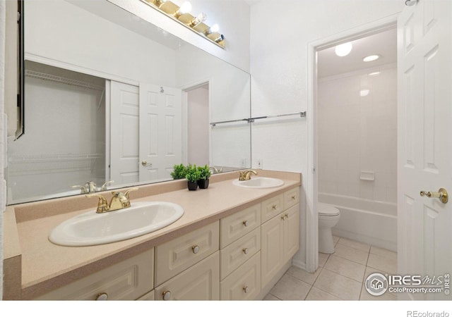 full bathroom featuring toilet, tile patterned flooring, tiled shower / bath combo, and vanity