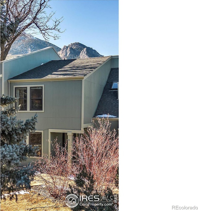 view of home's exterior with a mountain view