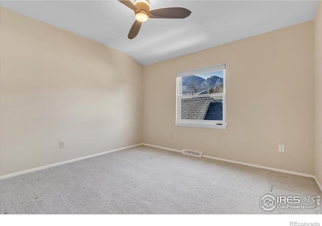 empty room with ceiling fan and carpet flooring