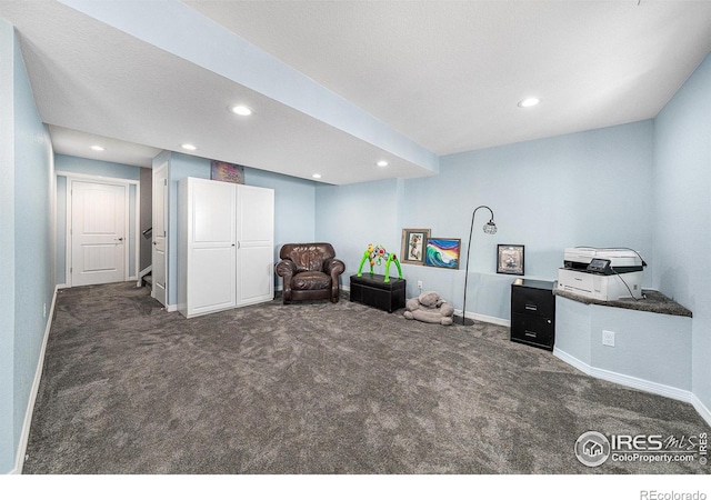 unfurnished room featuring dark colored carpet