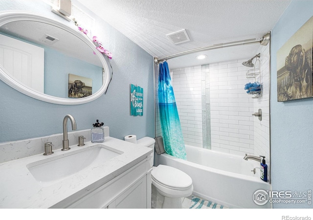 full bathroom featuring toilet, vanity, shower / bath combination with curtain, and a textured ceiling