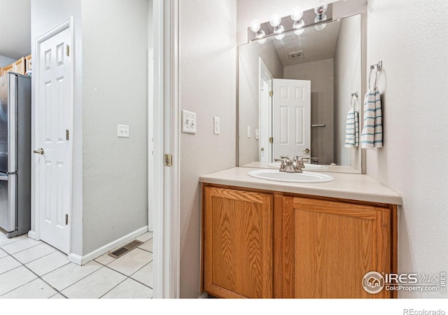 bathroom featuring tile patterned floors and vanity