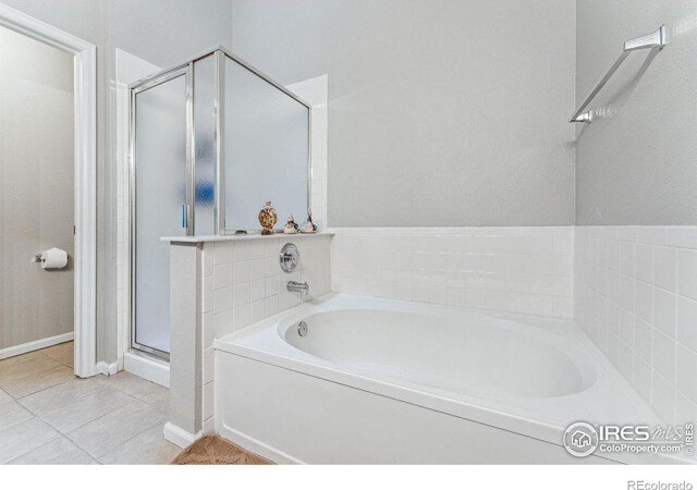 bathroom with plus walk in shower and tile patterned floors