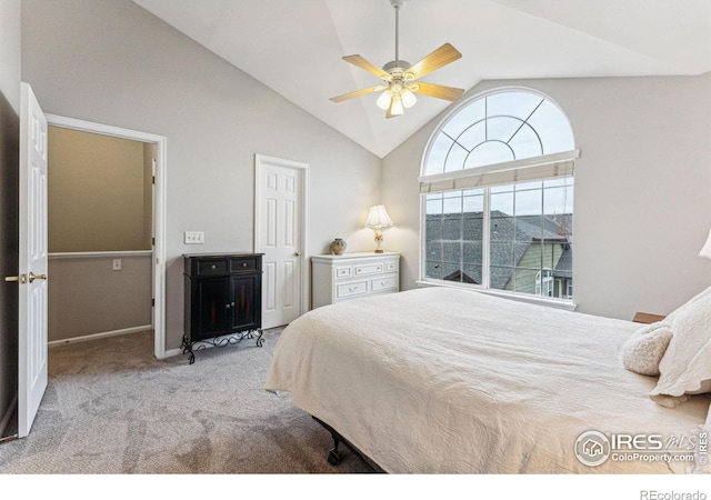 bedroom with ceiling fan, light colored carpet, and vaulted ceiling