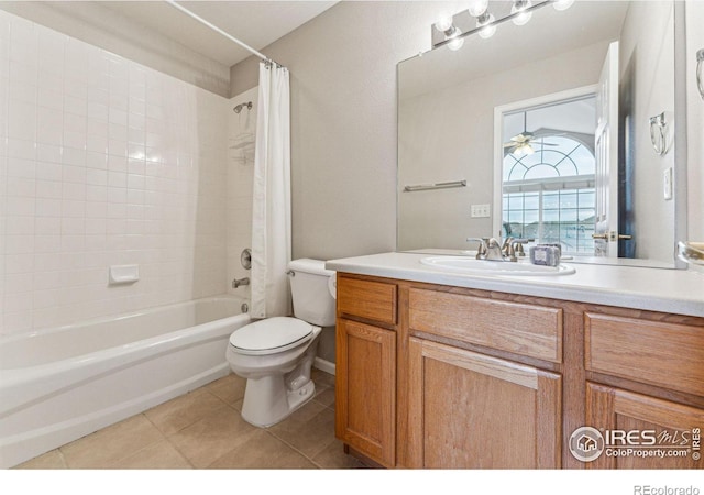 full bathroom featuring toilet, vanity, tile patterned flooring, ceiling fan, and shower / bathtub combination with curtain