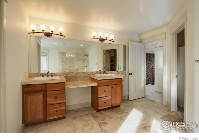 bathroom with vanity and a tile shower