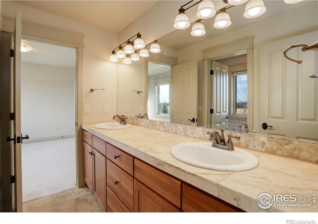 bathroom featuring tile patterned floors and vanity