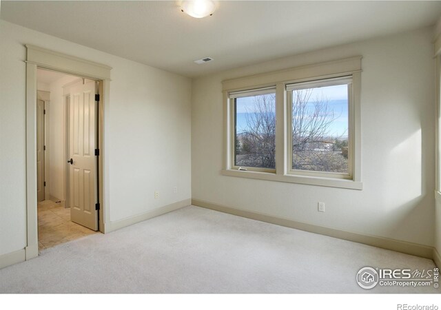 view of carpeted spare room