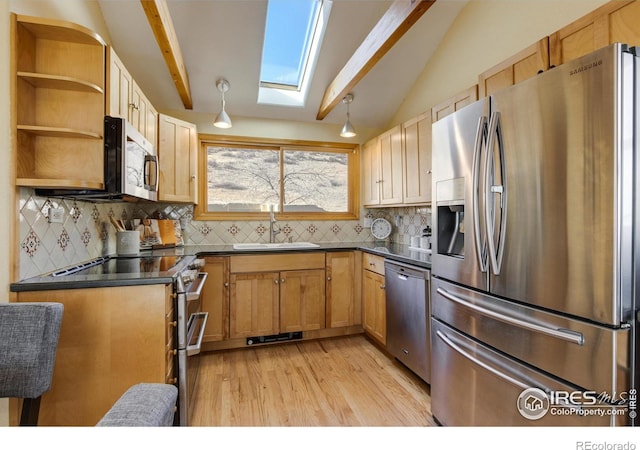 kitchen with sink, backsplash, stainless steel appliances, and light wood-type flooring