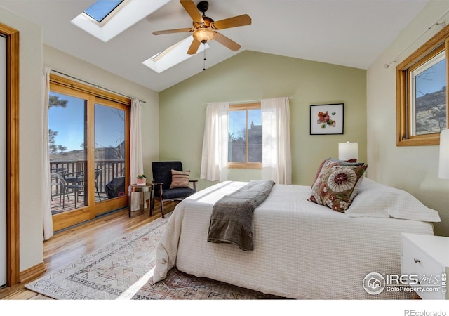 bedroom with ceiling fan, access to exterior, lofted ceiling, and light hardwood / wood-style flooring