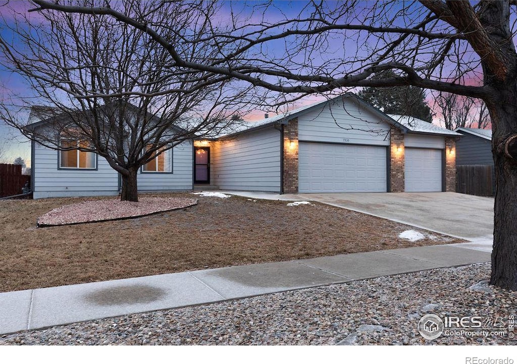 ranch-style home featuring a garage