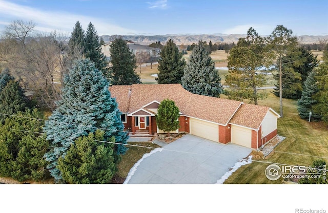 birds eye view of property with a mountain view