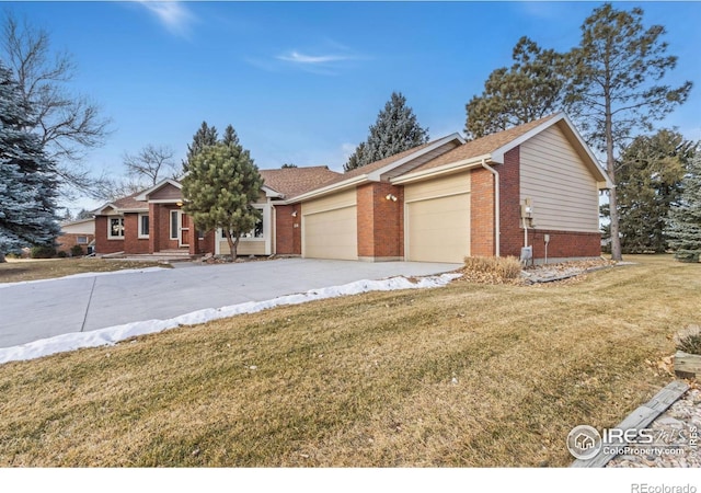 ranch-style home with a front yard and a garage