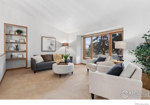 living room featuring light carpet and vaulted ceiling