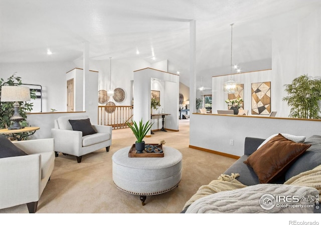 living room featuring lofted ceiling, light colored carpet, and an inviting chandelier