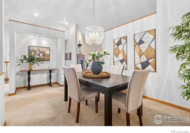 carpeted dining room featuring lofted ceiling and an inviting chandelier