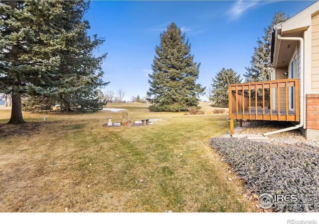 view of yard featuring a deck