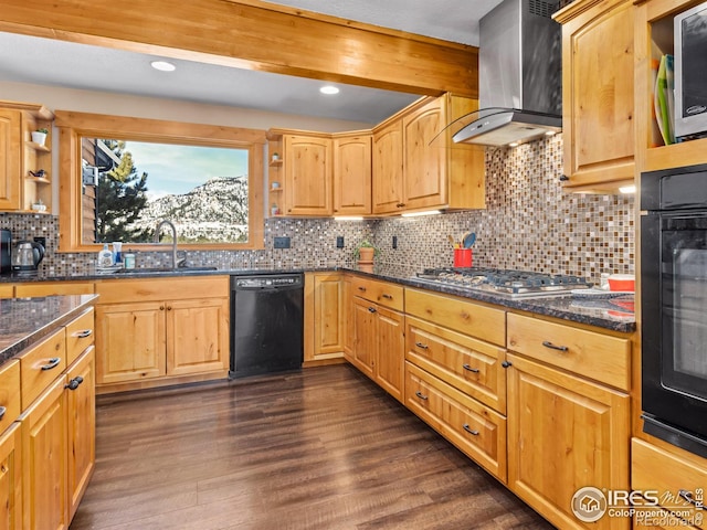 kitchen featuring sink, dark stone counters, island exhaust hood, dark hardwood / wood-style floors, and black appliances