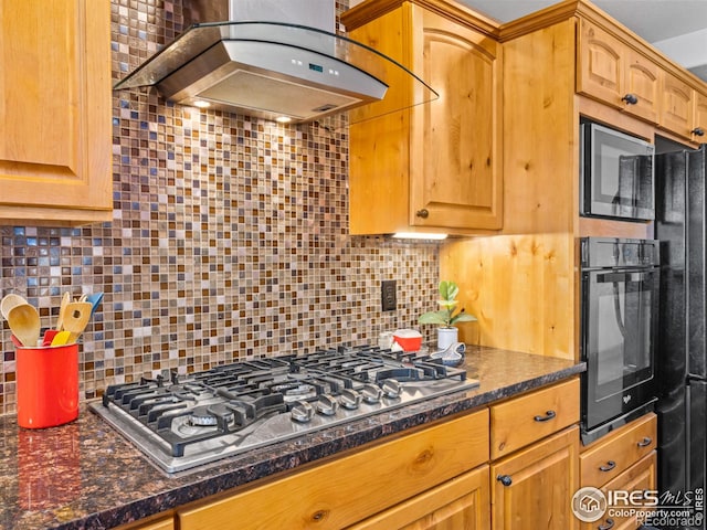 kitchen featuring range hood, black appliances, tasteful backsplash, and dark stone counters