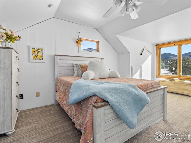 bedroom featuring ceiling fan, carpet floors, and lofted ceiling