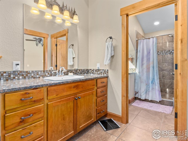 bathroom with tasteful backsplash, vanity, tile patterned floors, and a shower with shower curtain