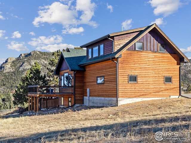 view of home's exterior featuring a wooden deck