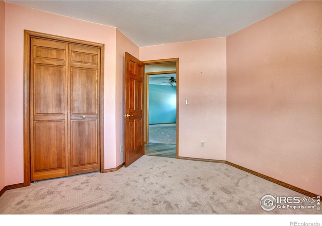 unfurnished bedroom with light colored carpet