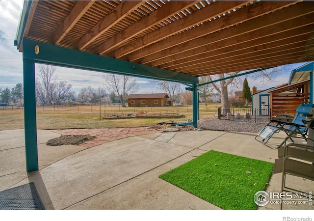 view of patio / terrace featuring a storage unit