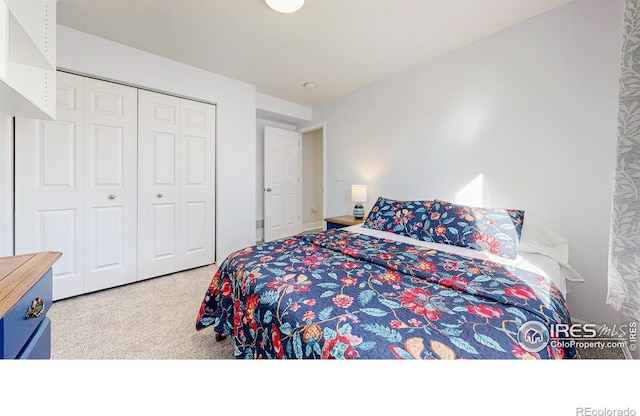 carpeted bedroom featuring a closet