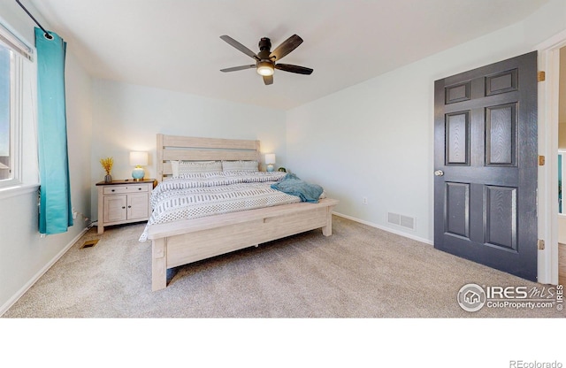 carpeted bedroom featuring ceiling fan