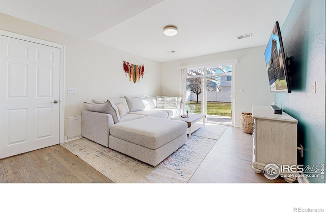 living room with hardwood / wood-style floors